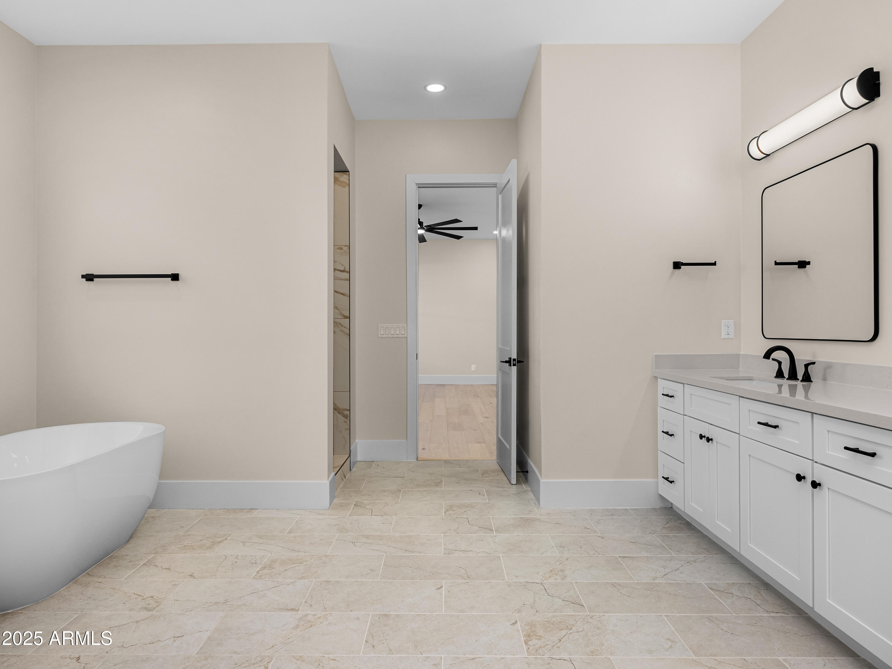 3002 North 53rd Place Phoenix, AZ 85018 - Photo 10 of 19 a bathroom with a granite countertop sink a toilet and shower