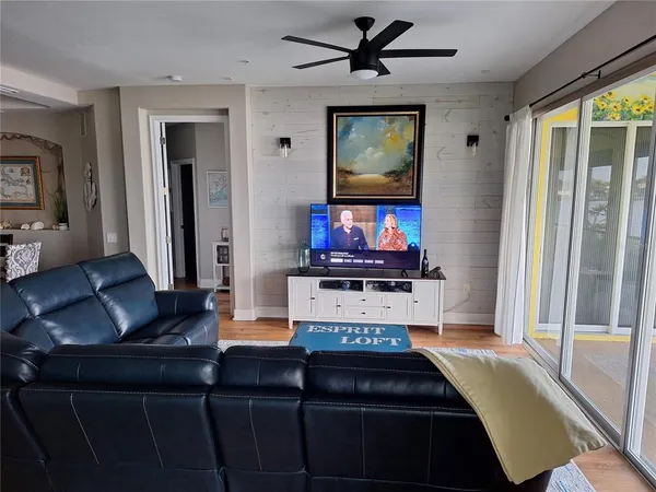 a living room with furniture and a window