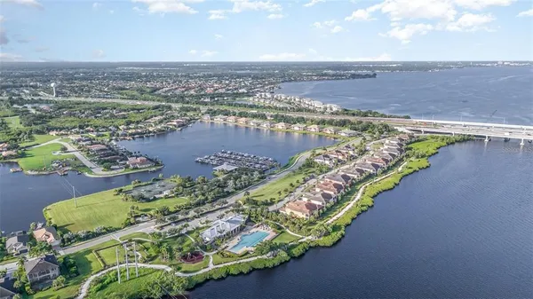 an aerial view of a city with lake view