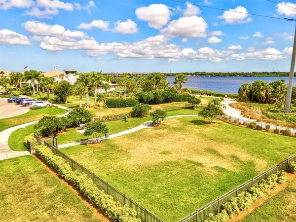 an aerial view of a house with a lake view