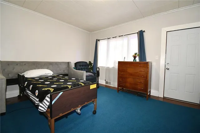 a bedroom with a bed and window