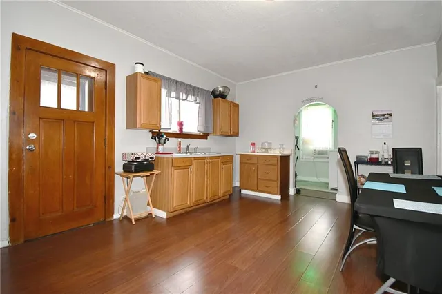 a view of a dining room with furniture and wooden floor