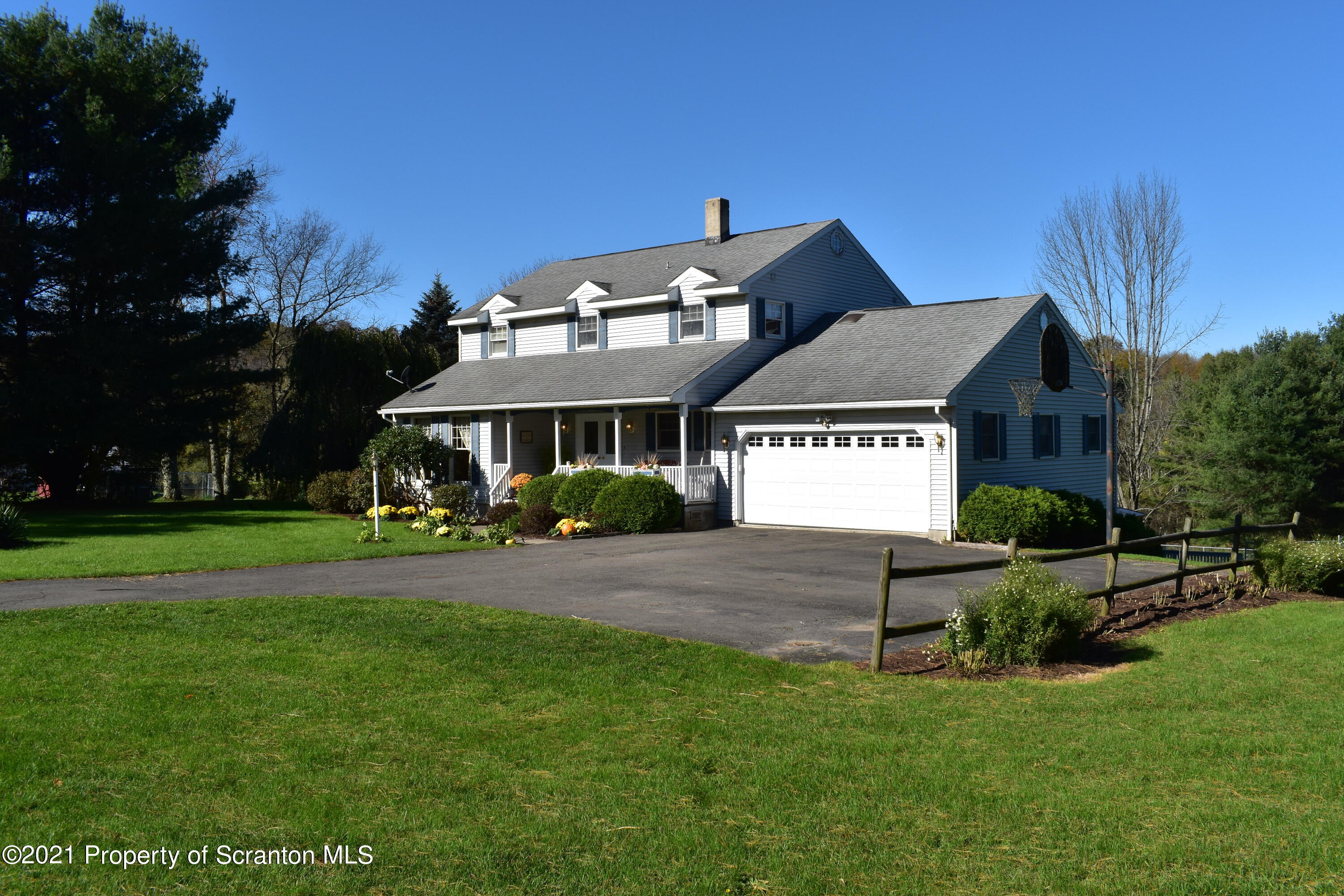 15375 State Rte 3001 Montrose, PA 18801 - Photo 1 of 82 a front view of a house with a yard