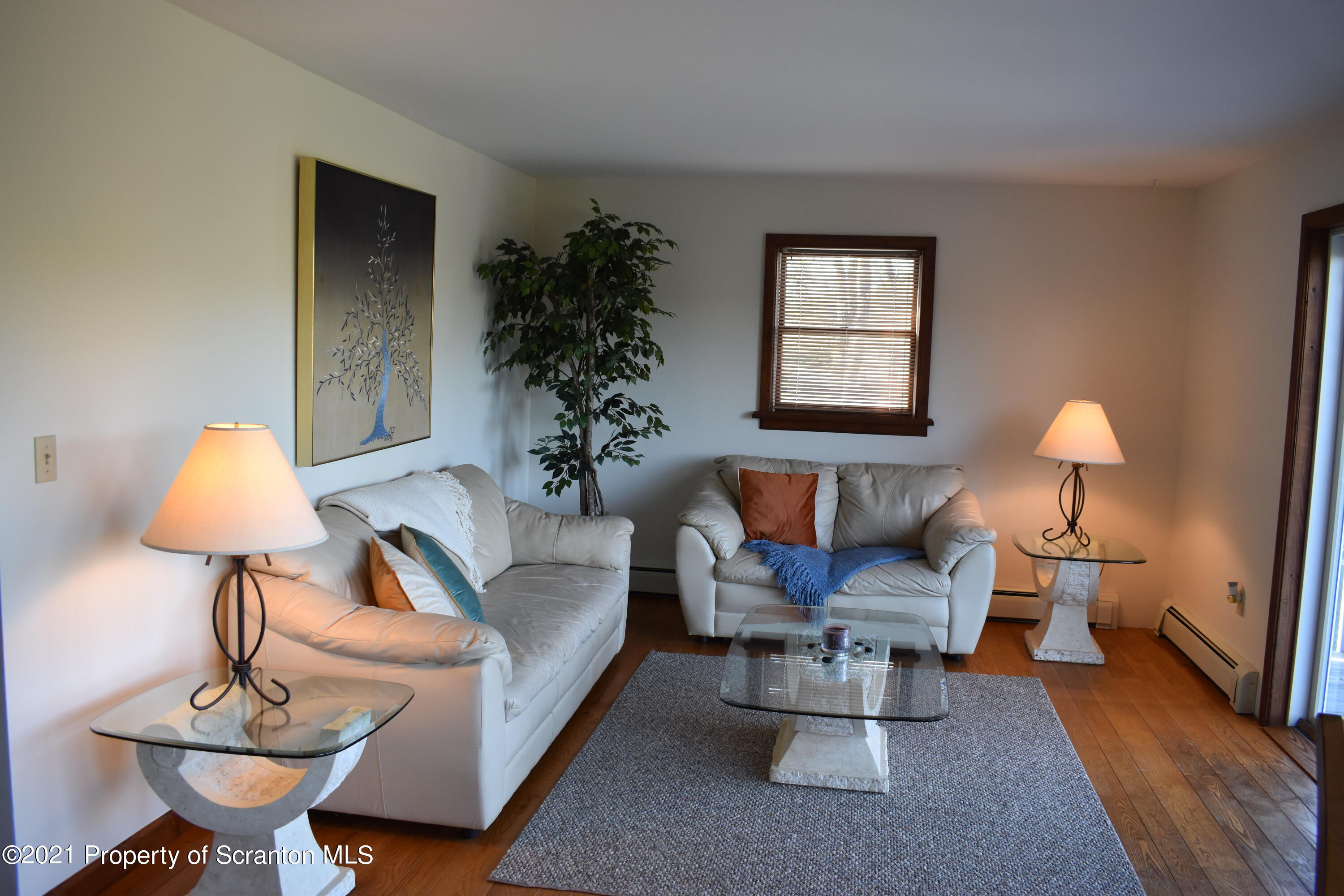 15375 State Rte 3001 Montrose, PA 18801 - Photo 20 of 82 a living room with furniture and a lamp