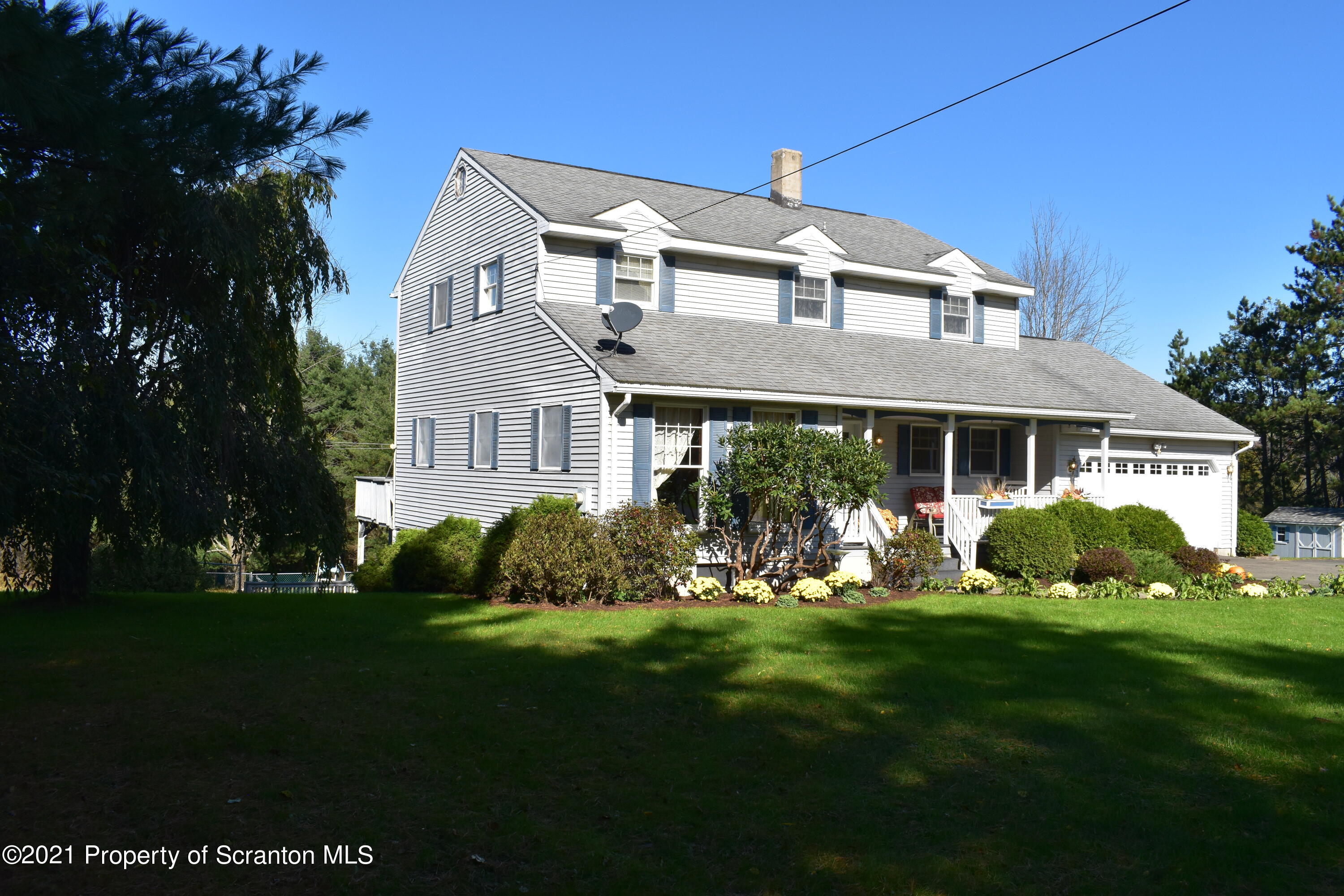 15375 State Rte 3001 Montrose, PA 18801 - Photo 2 of 82 a front view of a house with a yard