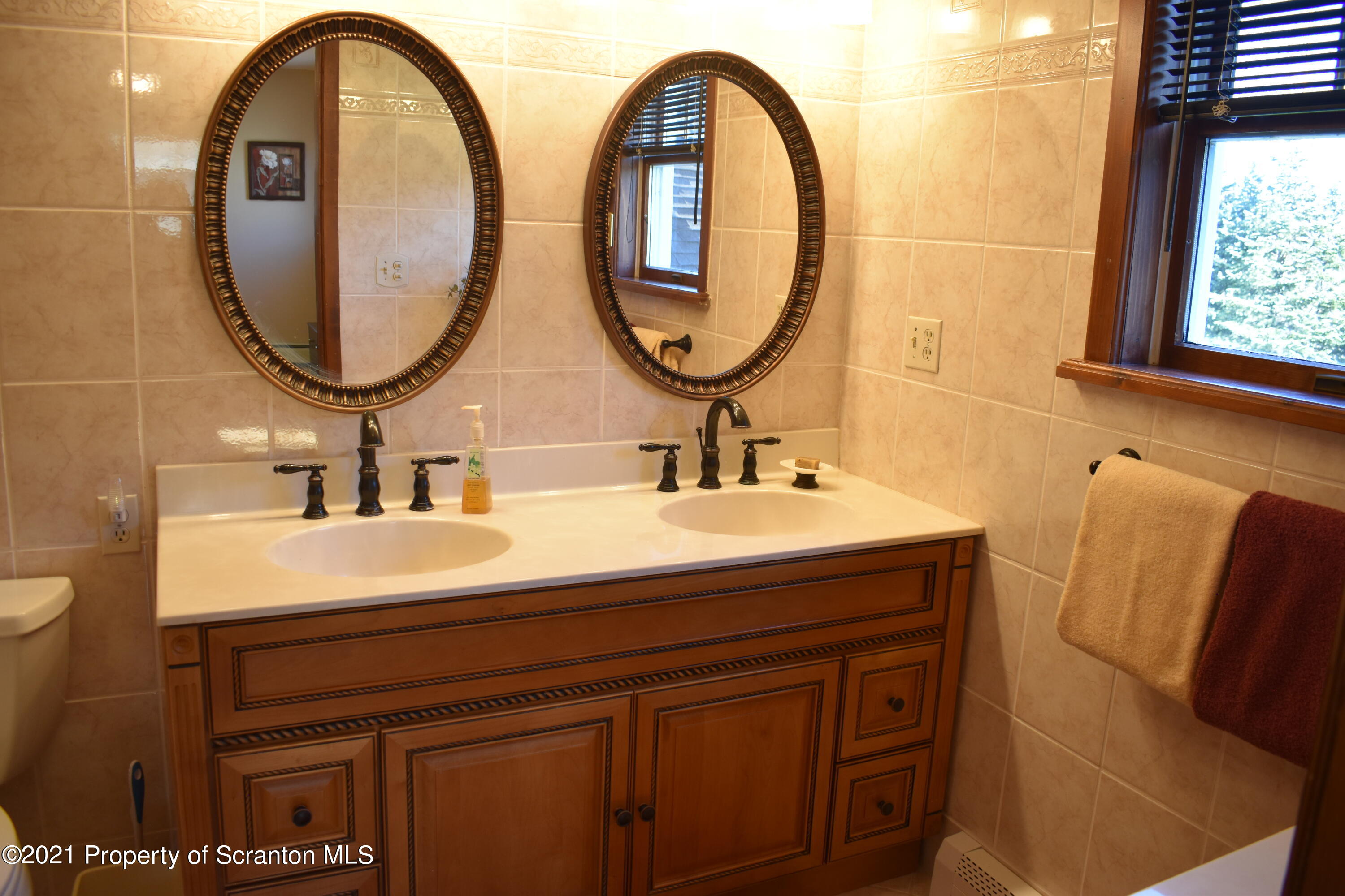 15375 State Rte 3001 Montrose, PA 18801 - Photo 30 of 82 a bathroom with a sink and a mirror