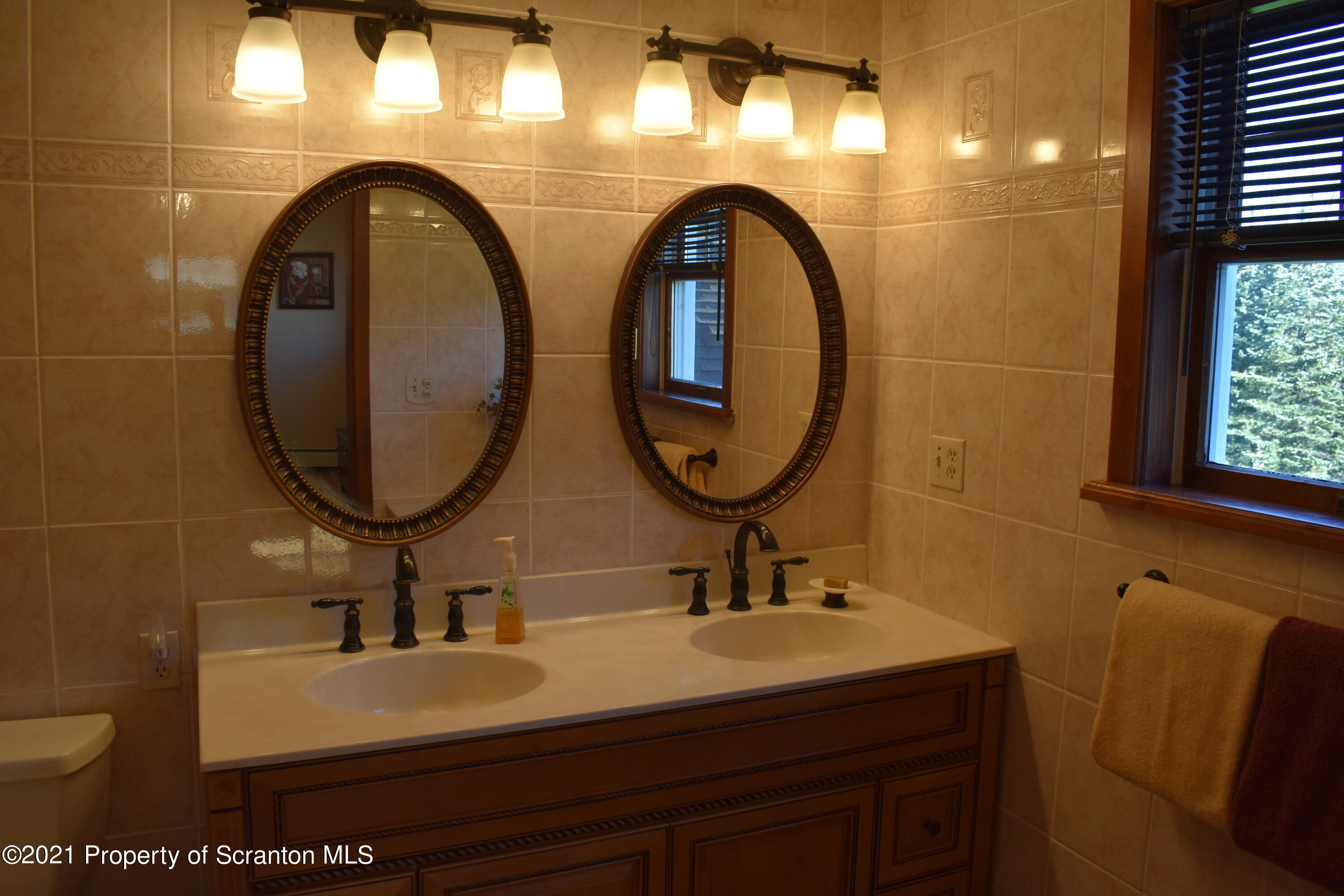 15375 State Rte 3001 Montrose, PA 18801 - Photo 31 of 82 a bathroom with a sink and a mirror