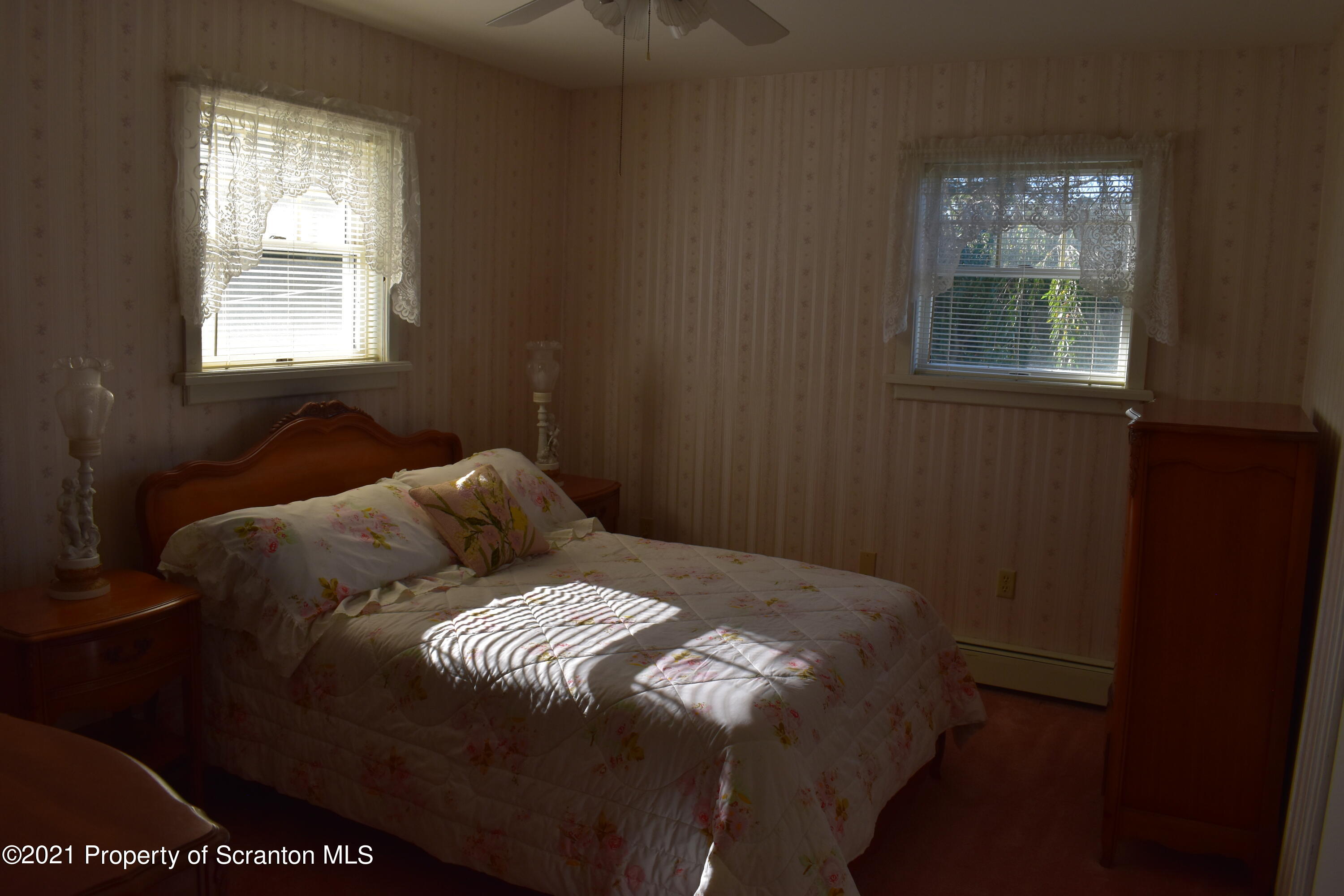 15375 State Rte 3001 Montrose, PA 18801 - Photo 34 of 82 a bed sitting in a bedroom next to a window