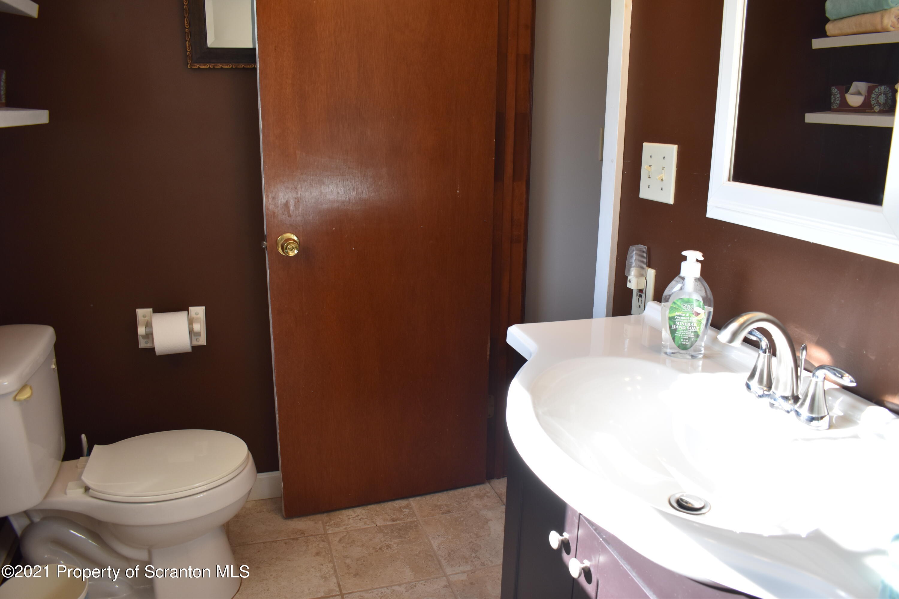 15375 State Rte 3001 Montrose, PA 18801 - Photo 36 of 82 a bathroom with a sink a toilet and mirror