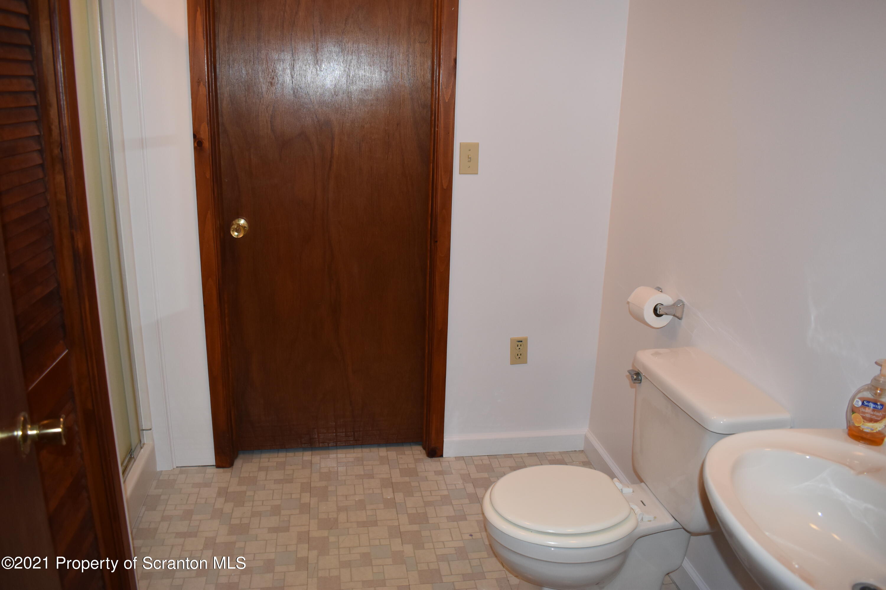 15375 State Rte 3001 Montrose, PA 18801 - Photo 48 of 82 a bathroom with a granite countertop toilet and a sink