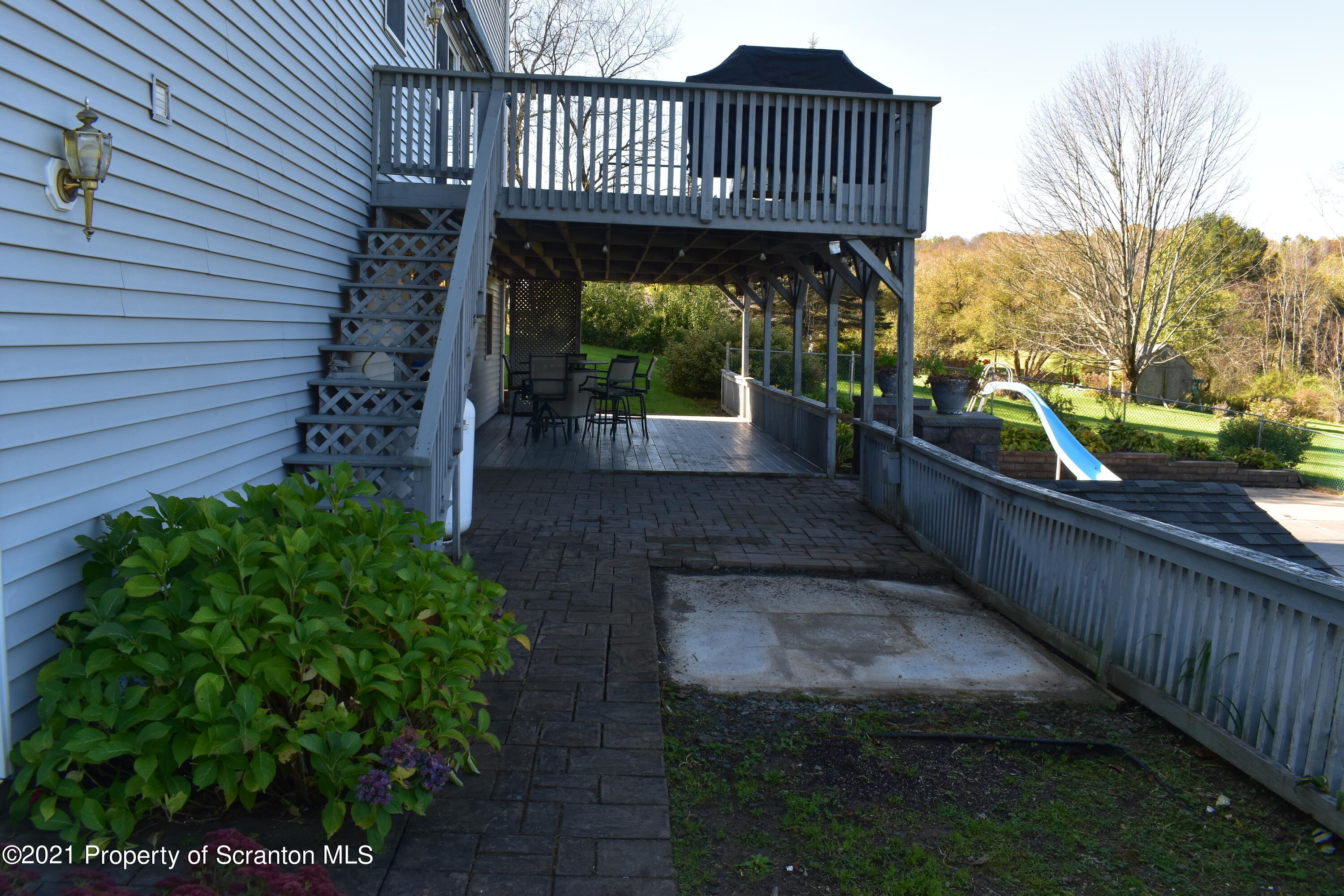 15375 State Rte 3001 Montrose, PA 18801 - Photo 58 of 82 a view of a roof deck with table and chairs with wooden floor and stairs