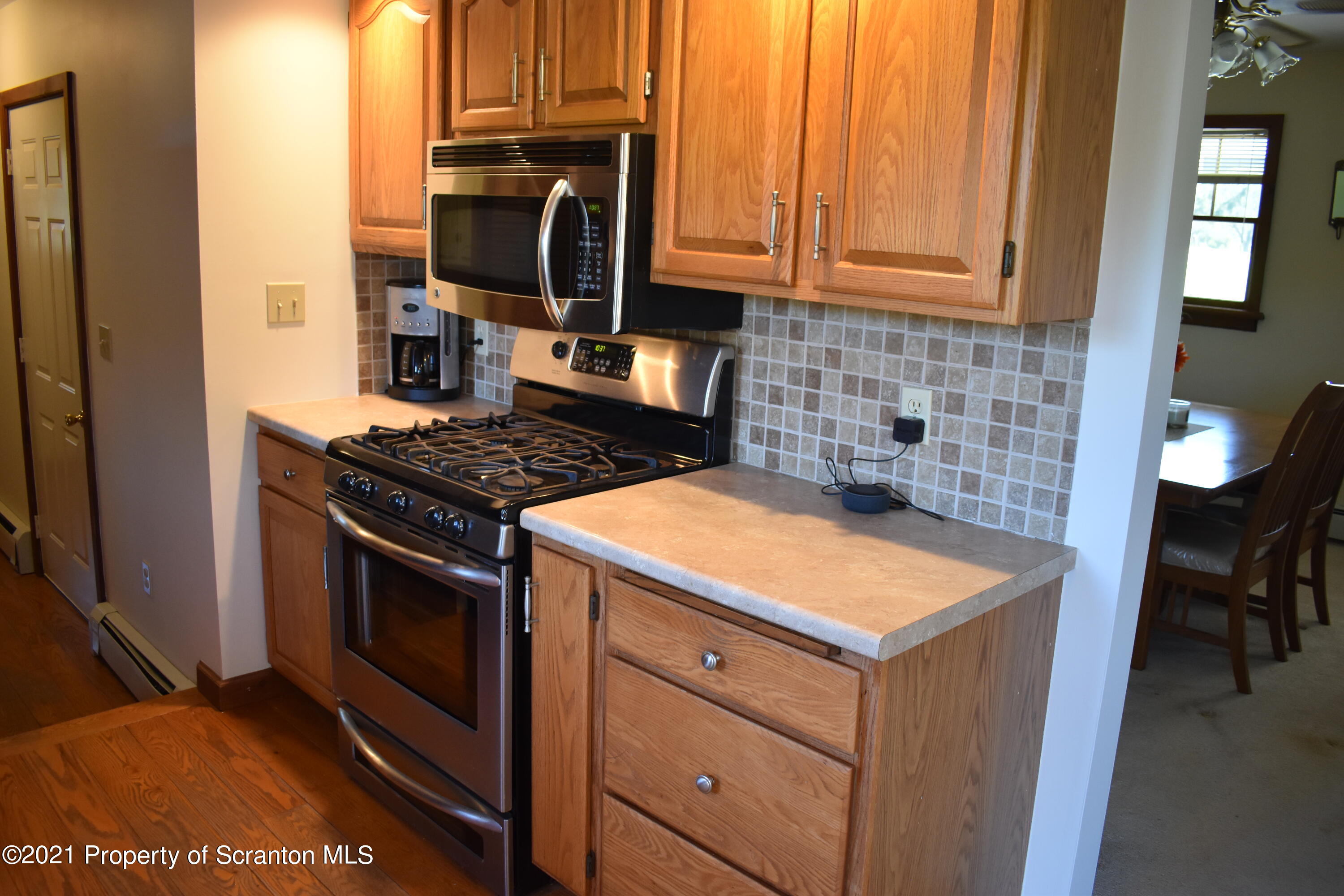15375 State Rte 3001 Montrose, PA 18801 - Photo 10 of 82 a kitchen with stainless steel appliances granite countertop a stove a sink and a microwave