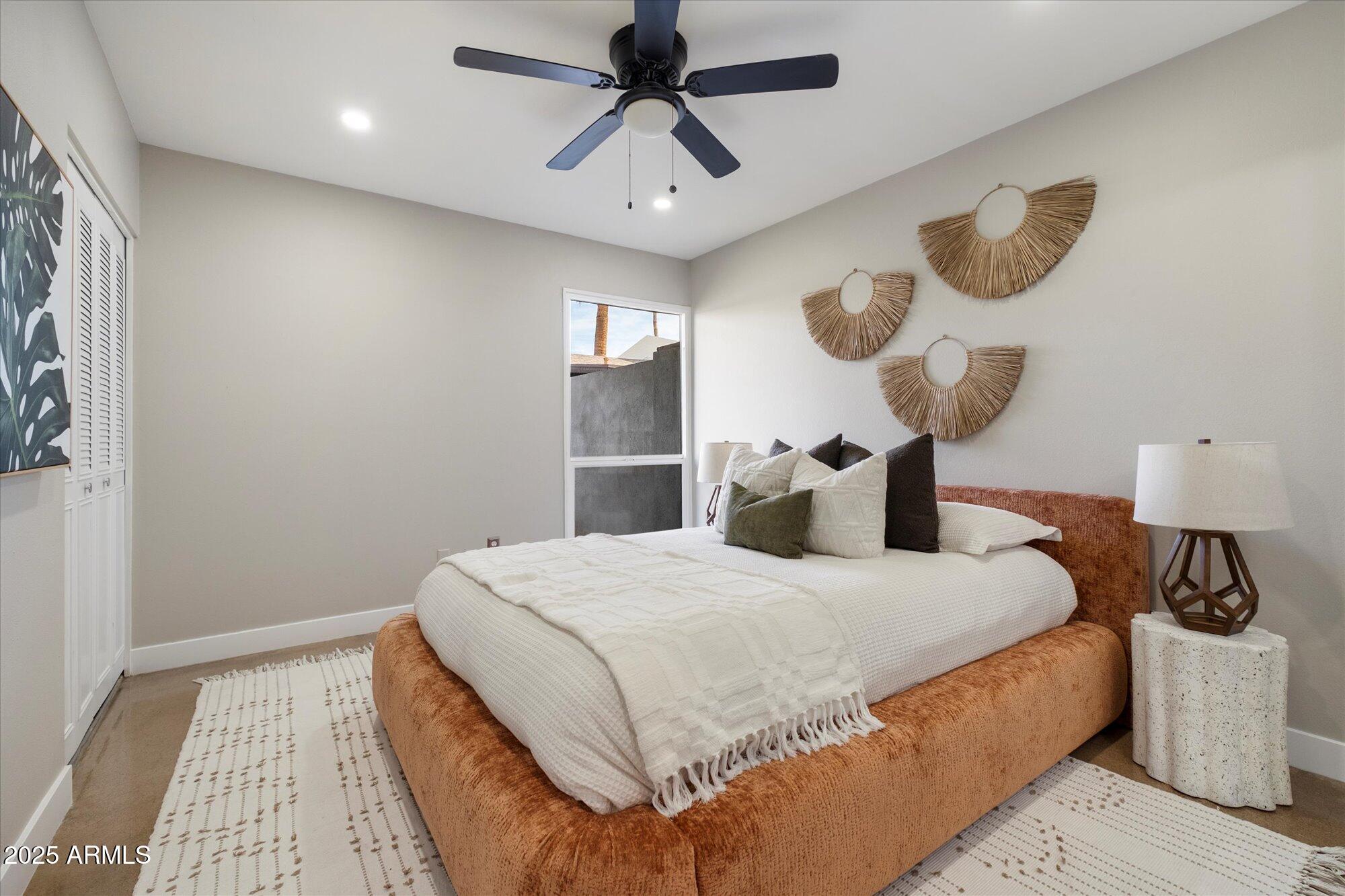 1450 East Bethany Home Road, Unit 8 Phoenix, AZ 85014 - Photo 11 of 30 a bedroom with a bed and closet