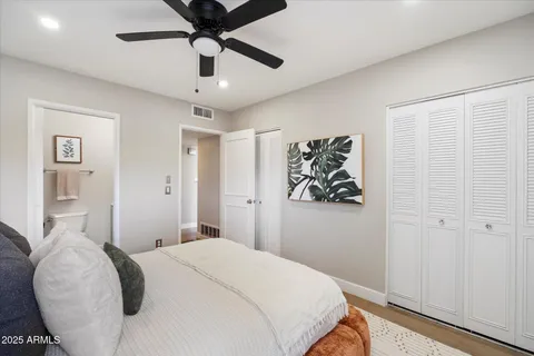 a bedroom with a bed and closet