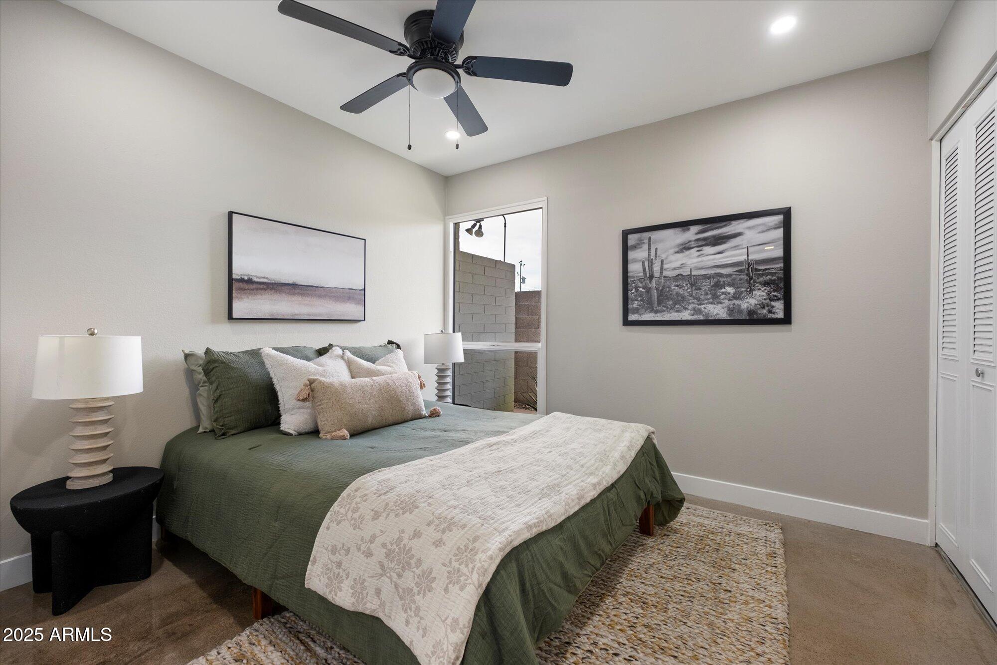 1450 East Bethany Home Road, Unit 8 Phoenix, AZ 85014 - Photo 15 of 30 a bedroom with a bed and a painting on the wall