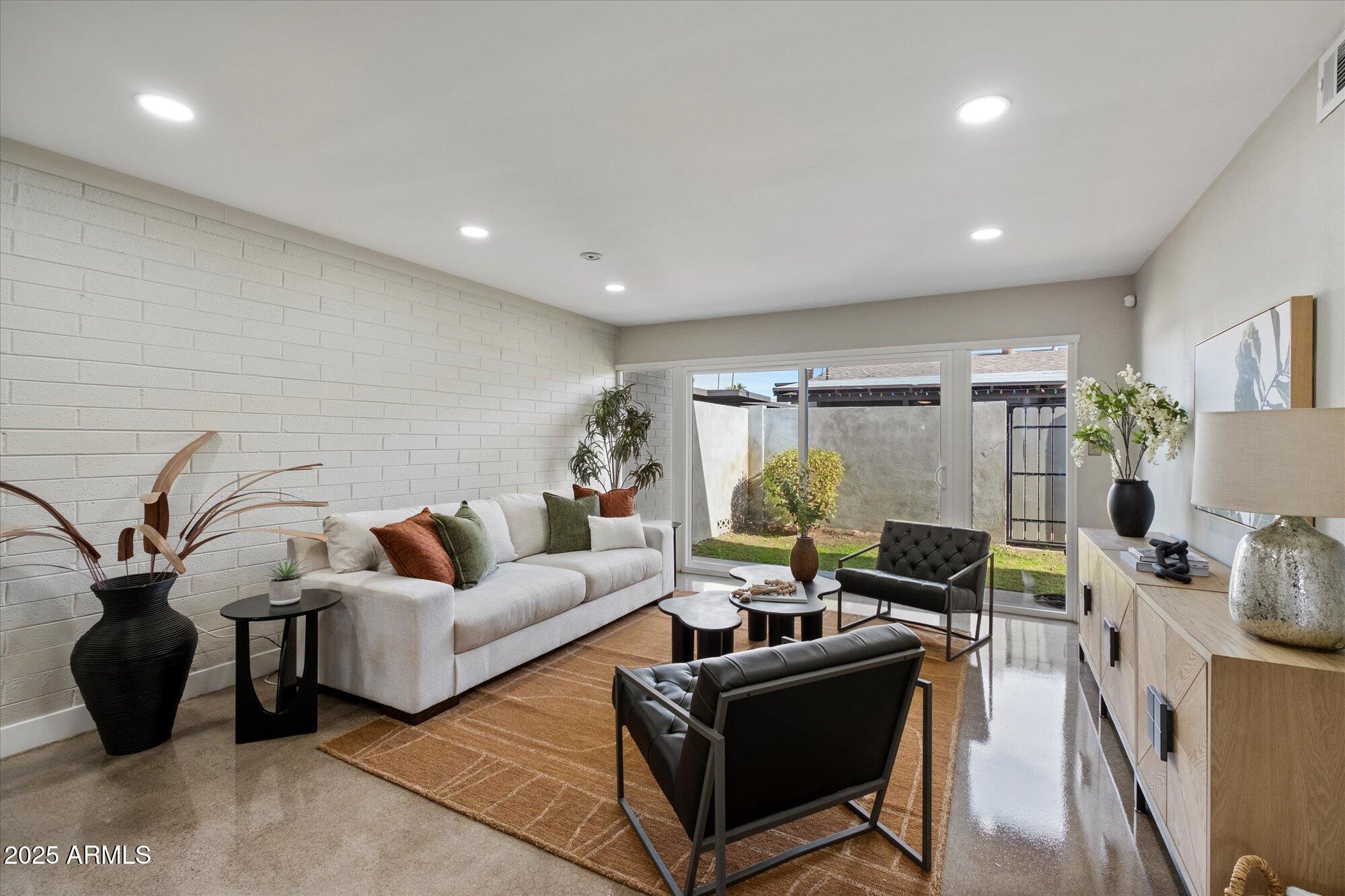 1450 East Bethany Home Road, Unit 8 Phoenix, AZ 85014 - Photo 29 of 29 a living room with furniture