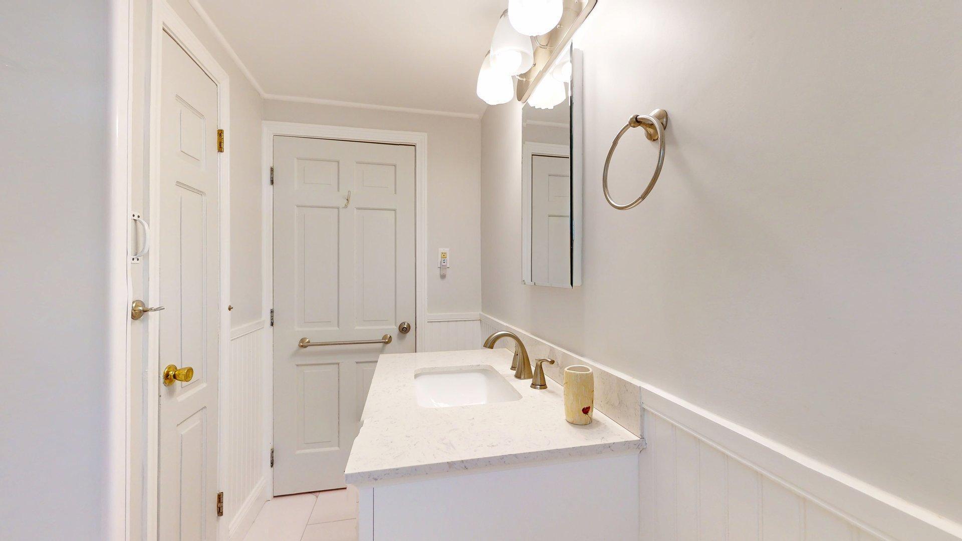 26 Newport Road Brewster, MA 02631 - Photo 20 of 61 a bathroom with a sink and a mirror