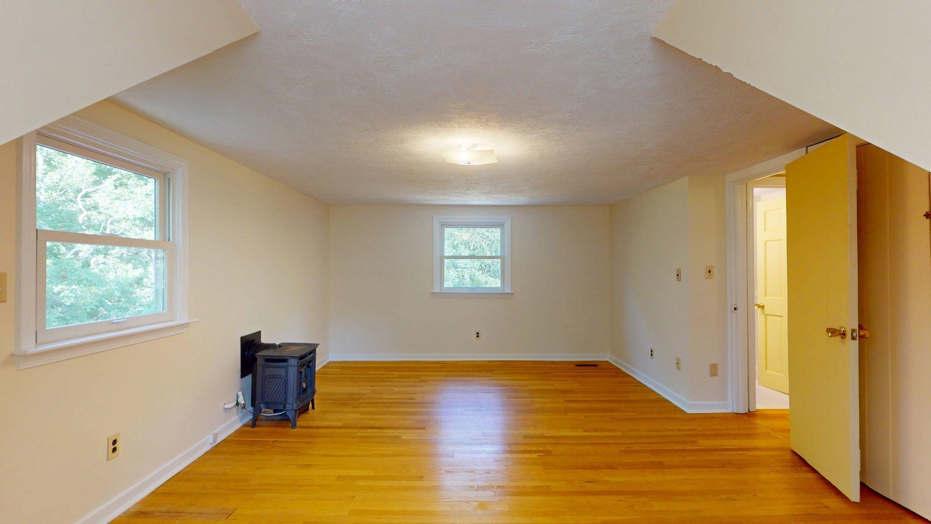 26 Newport Road Brewster, MA 02631 - Photo 46 of 61 a view of empty room with wooden floor and fan