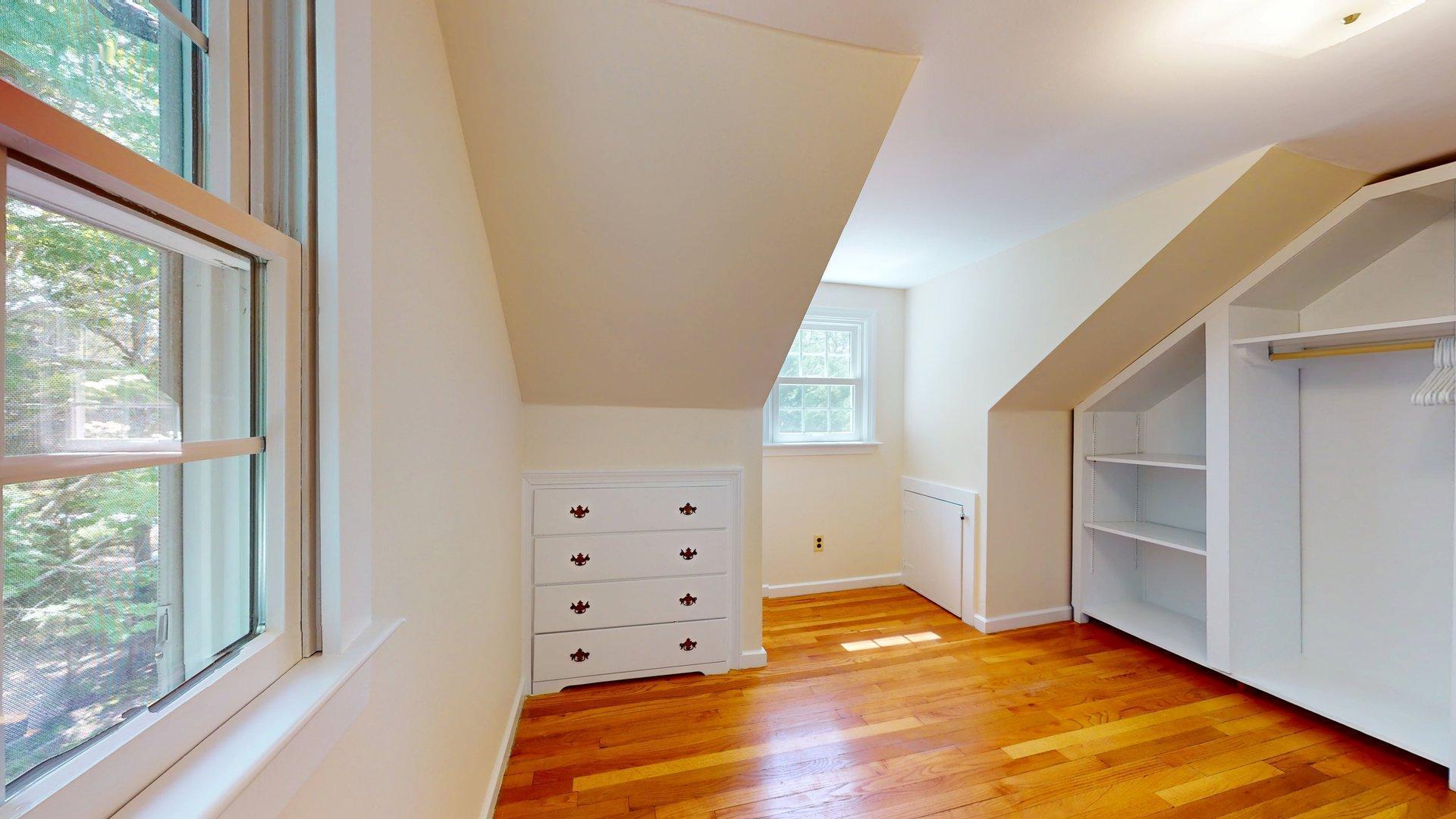 26 Newport Road Brewster, MA 02631 - Photo 47 of 61 a view of an empty room with wooden floor and windows