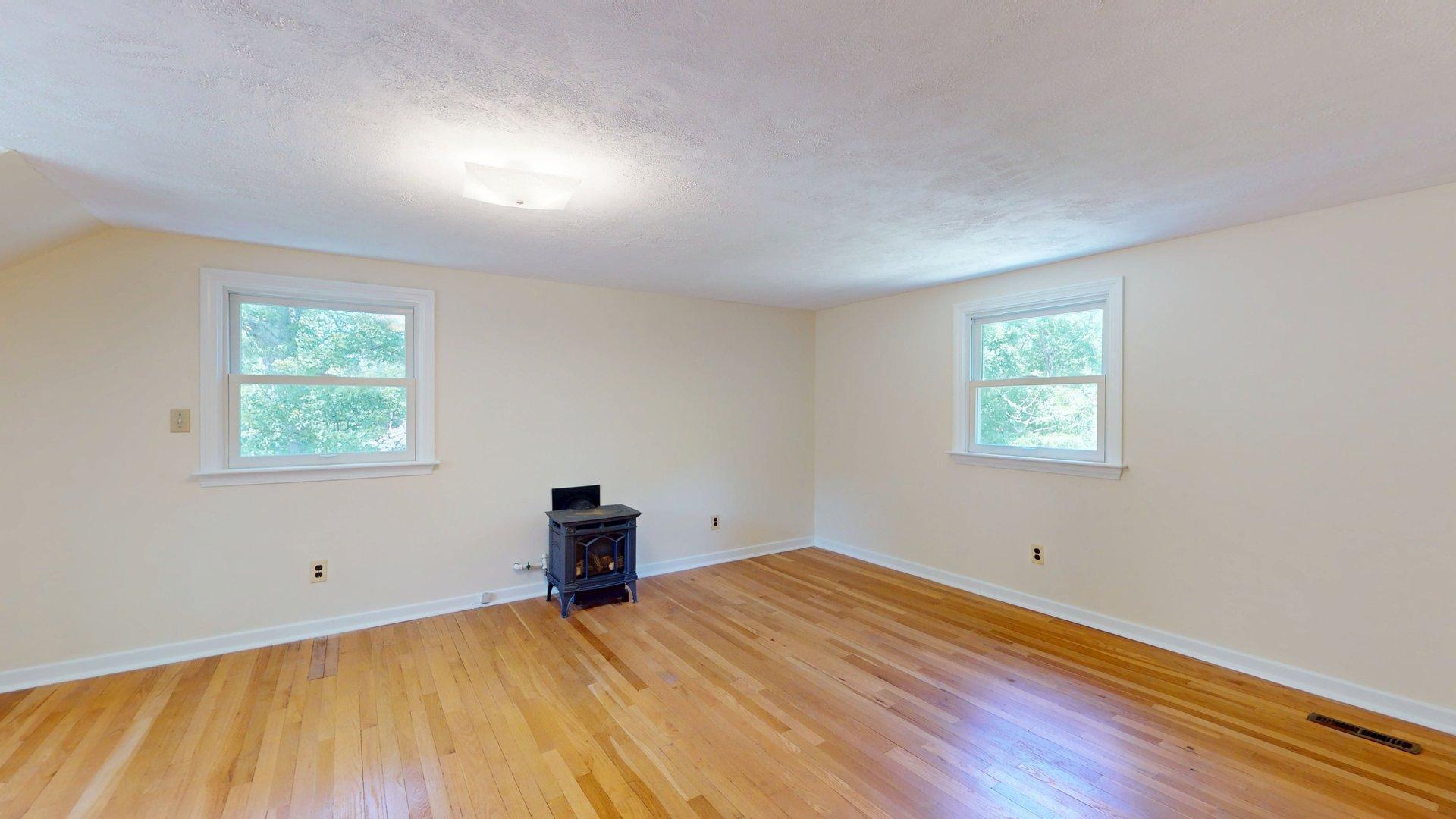 26 Newport Road Brewster, MA 02631 - Photo 48 of 61 a view of empty room with wooden floor and fan