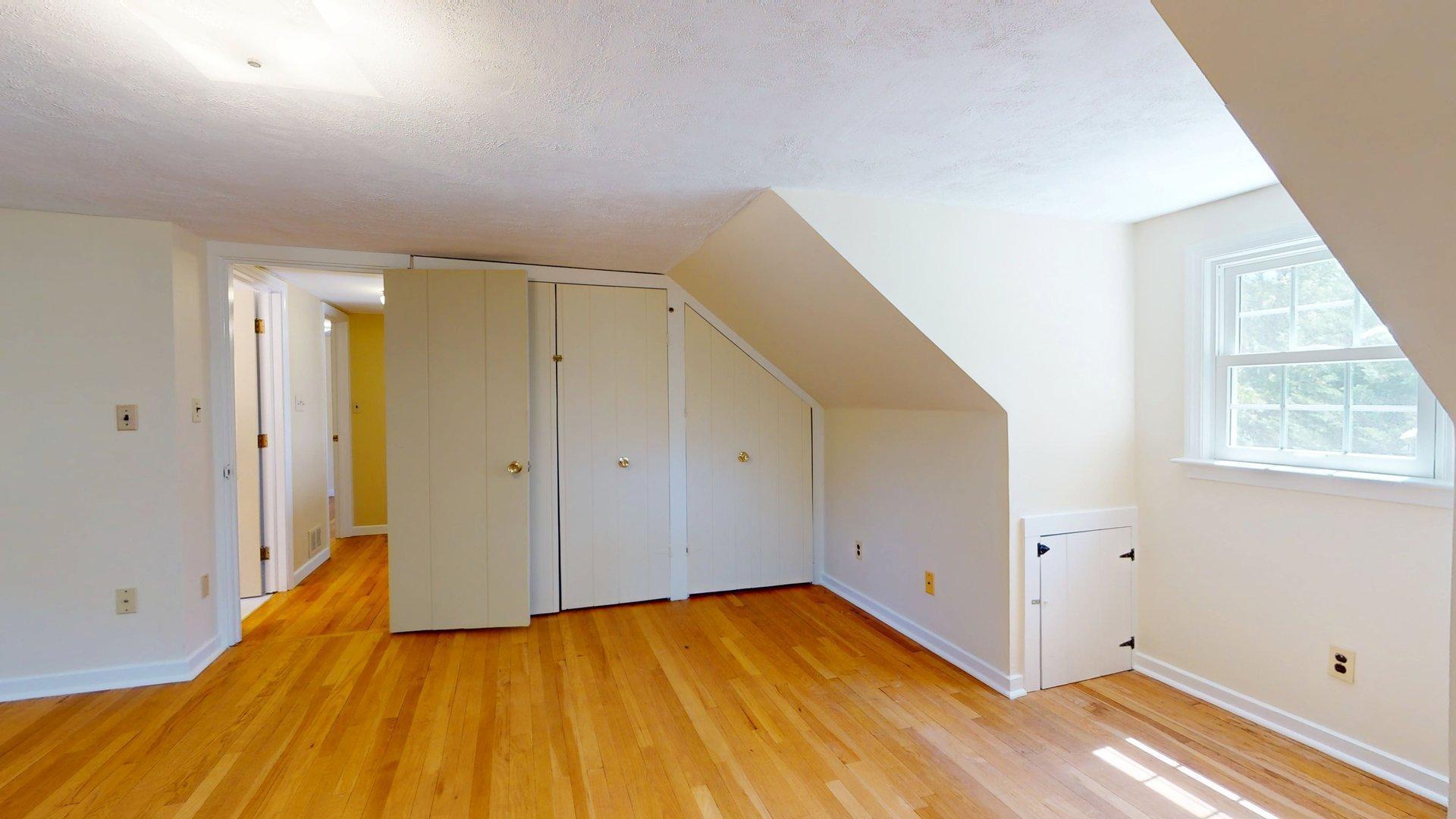 26 Newport Road Brewster, MA 02631 - Photo 50 of 61 a view of an empty room with wooden floor and a window