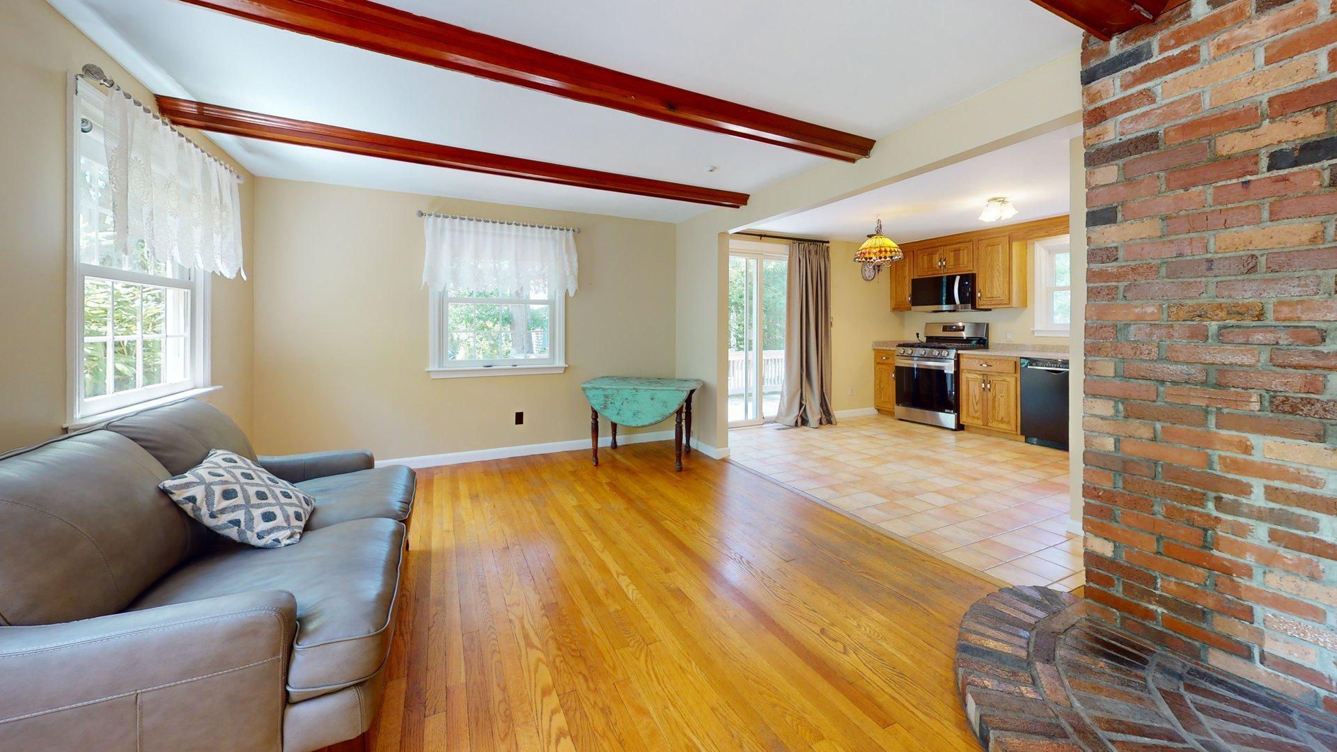 26 Newport Road Brewster, MA 02631 - Photo 5 of 61 a living room with furniture and a wooden floor