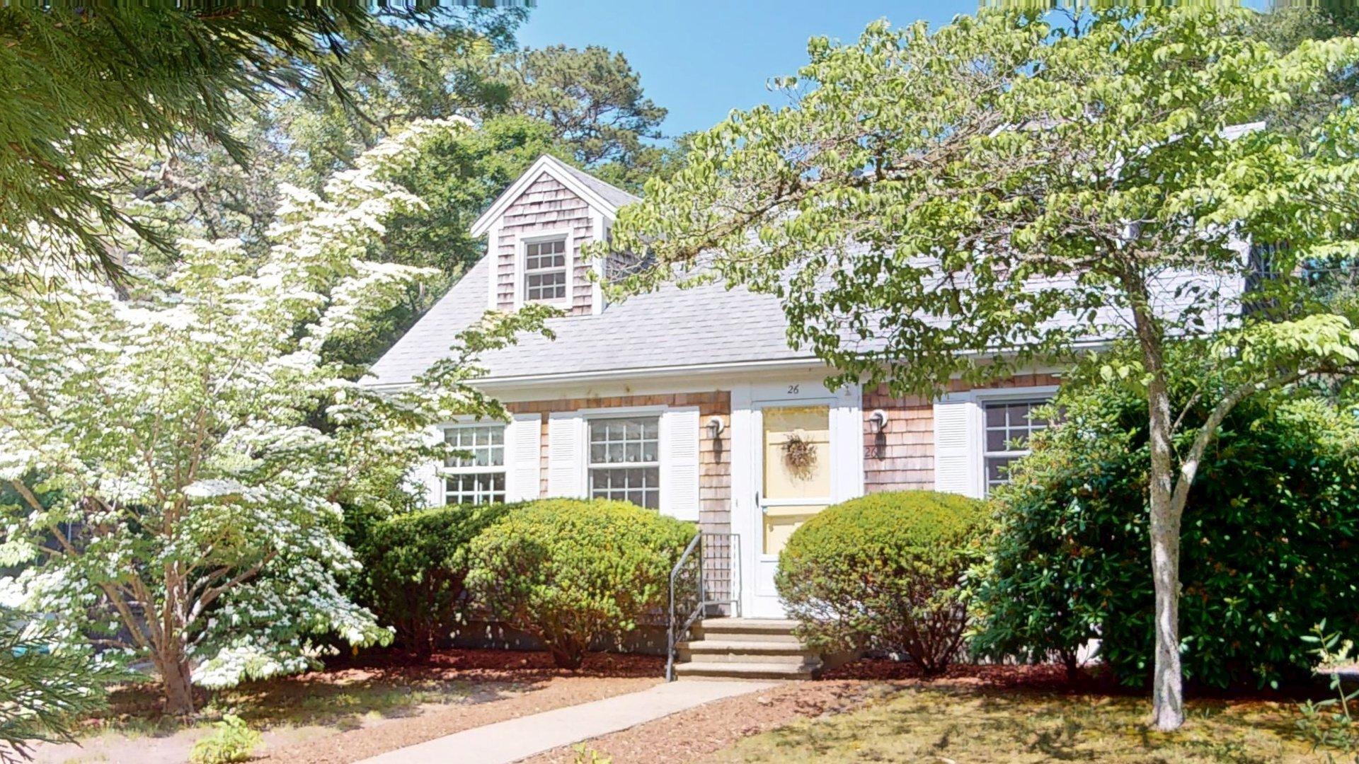 26 Newport Road Brewster, MA 02631 - Photo 61 of 61 a front view of a house with a yard