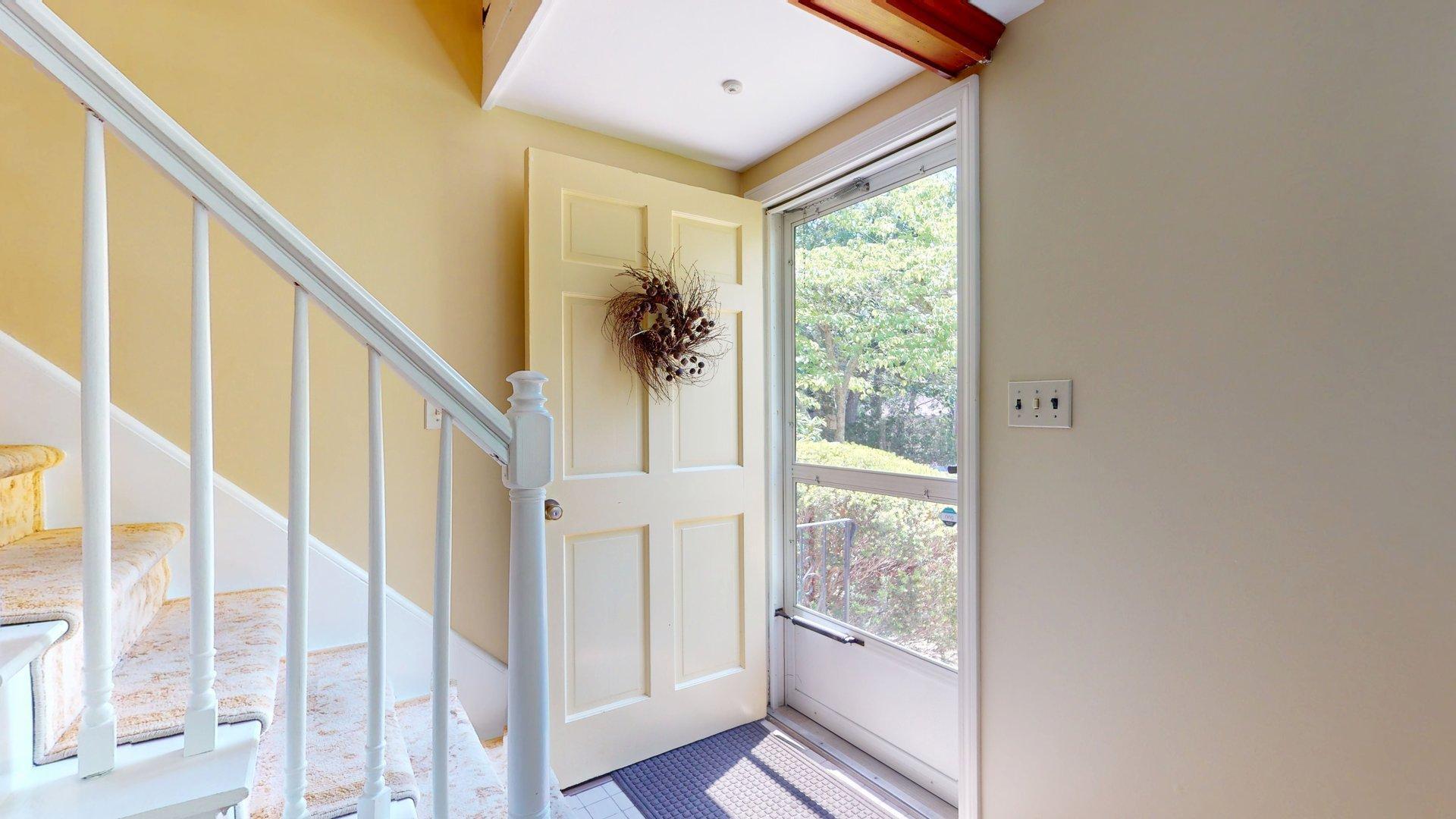 26 Newport Road Brewster, MA 02631 - Photo 10 of 61 a view of an entryway with wooden floor and door