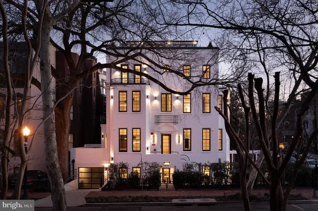 a front view of a house with yard
