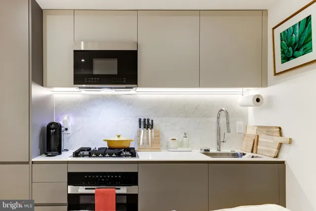 a kitchen with a sink and cabinets