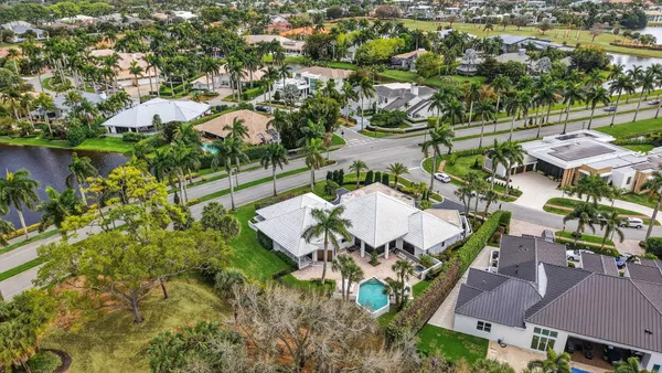 an aerial view of a house with yard swimming pool and outdoor seating