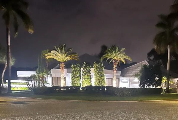 a view of a house with a yard and street view