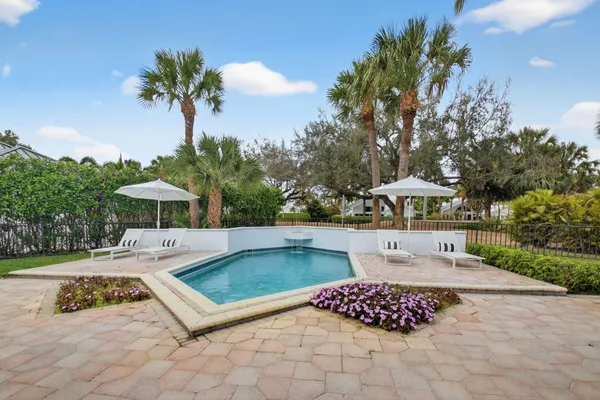 a view of a swimming pool with a patio