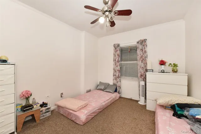 a bedroom with a bed and cabinets