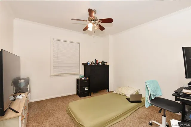 a bedroom with a workspace