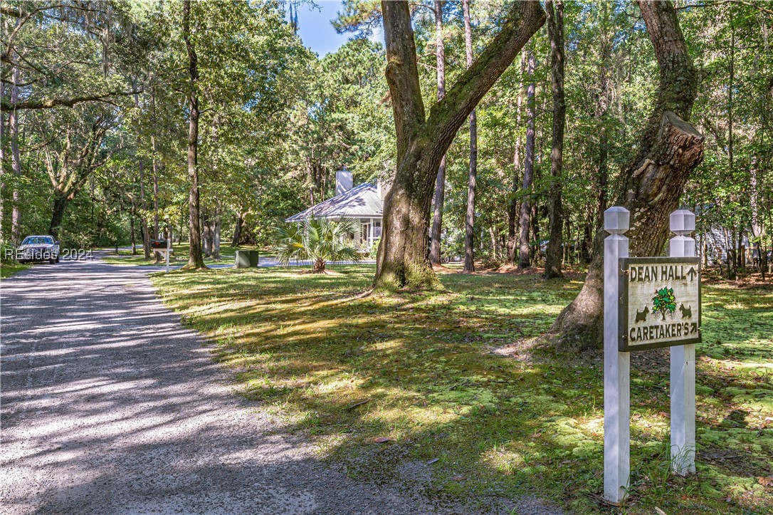 92 Dean Hall Road Seabrook, SC 29940 - Photo 21 of 99 Property arrival point / caretaker's cottage is the first structure visible