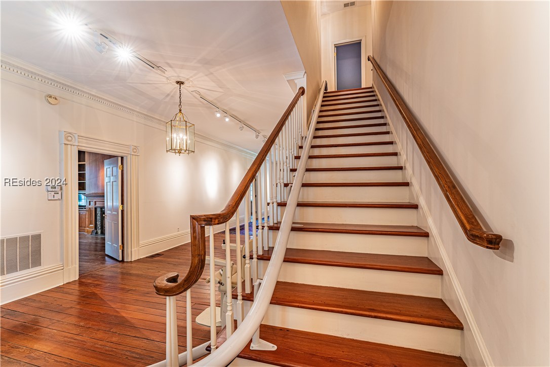 92 Dean Hall Road Seabrook, SC 29940 - Photo 45 of 99 Staircase detail; primary residence entrance foyer & gallery leading to staircase