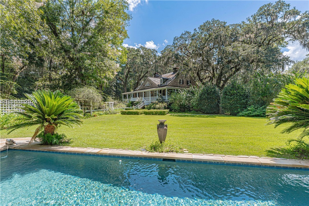 92 Dean Hall Road Seabrook, SC 29940 - Photo 52 of 99 Pool view to primary residence