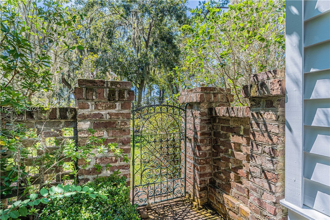 92 Dean Hall Road Seabrook, SC 29940 - Photo 55 of 99 Sample of fence and ironwork surrounding primary residence
