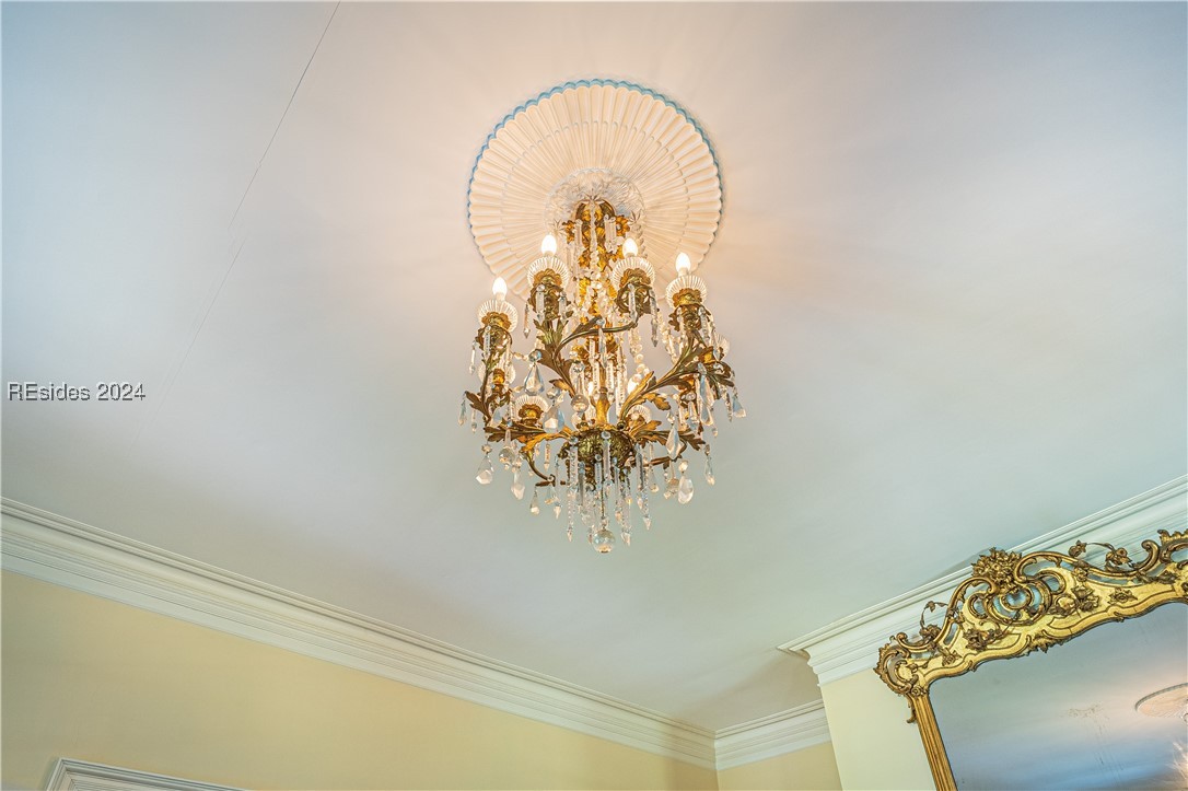 92 Dean Hall Road Seabrook, SC 29940 - Photo 77 of 99 Primary residence living room chandelier