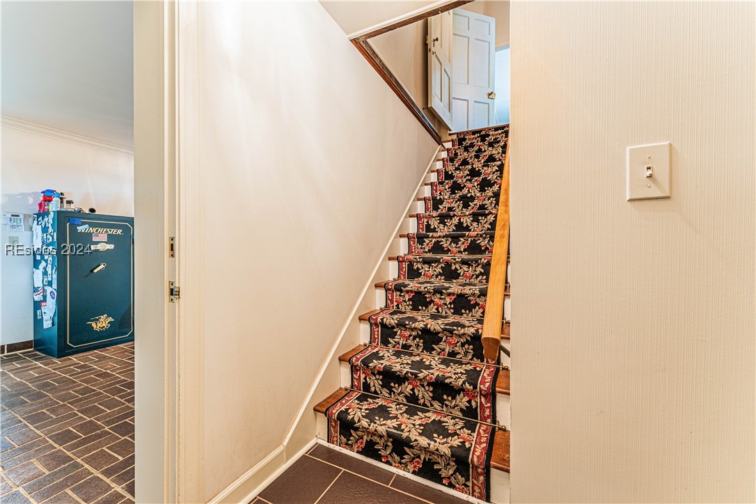 92 Dean Hall Road Seabrook, SC 29940 - Photo 94 of 99 Primary residence staircase between ground floor and 2nd floor