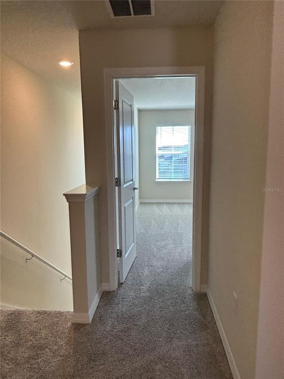 16274 Bright Leaf Road Winter Garden, FL 34787 - Photo 14 of 38 a view of a hallway with a room