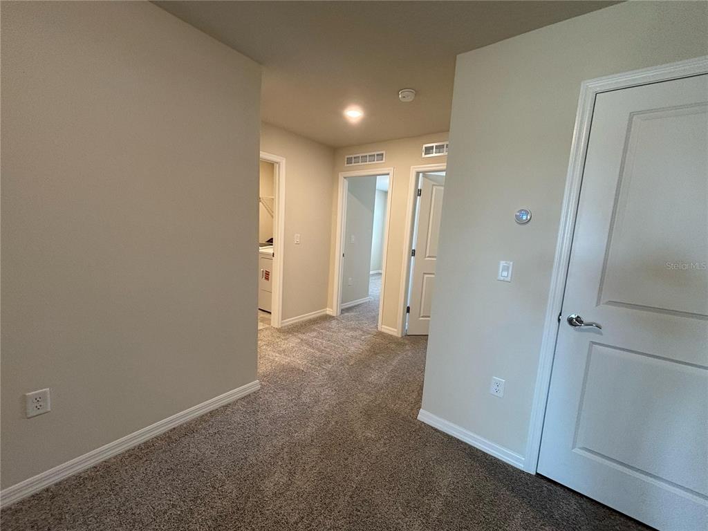 16274 Bright Leaf Road Winter Garden, FL 34787 - Photo 15 of 38 a view of hallway with a bathroom