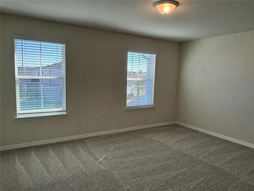 16274 Bright Leaf Road Winter Garden, FL 34787 - Photo 17 of 38 an empty room with a window