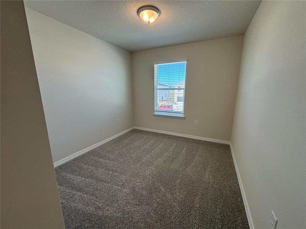16274 Bright Leaf Road Winter Garden, FL 34787 - Photo 24 of 38 an empty room with a window