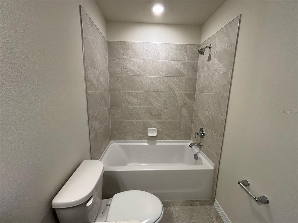 16274 Bright Leaf Road Winter Garden, FL 34787 - Photo 30 of 38 a bathroom with a sink toilet and bathtub