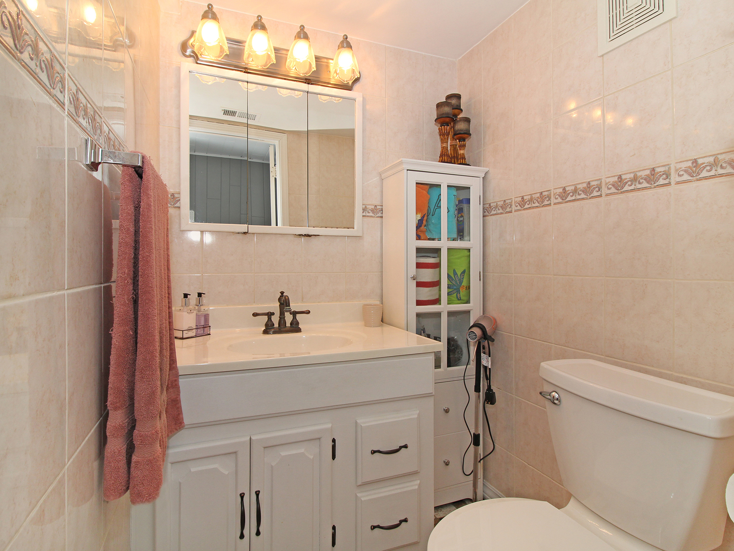 554 Rockhurst Road Bolingbrook, IL 60440 - Photo 14 of 29 a bathroom with a sink a toilet a mirror and shower