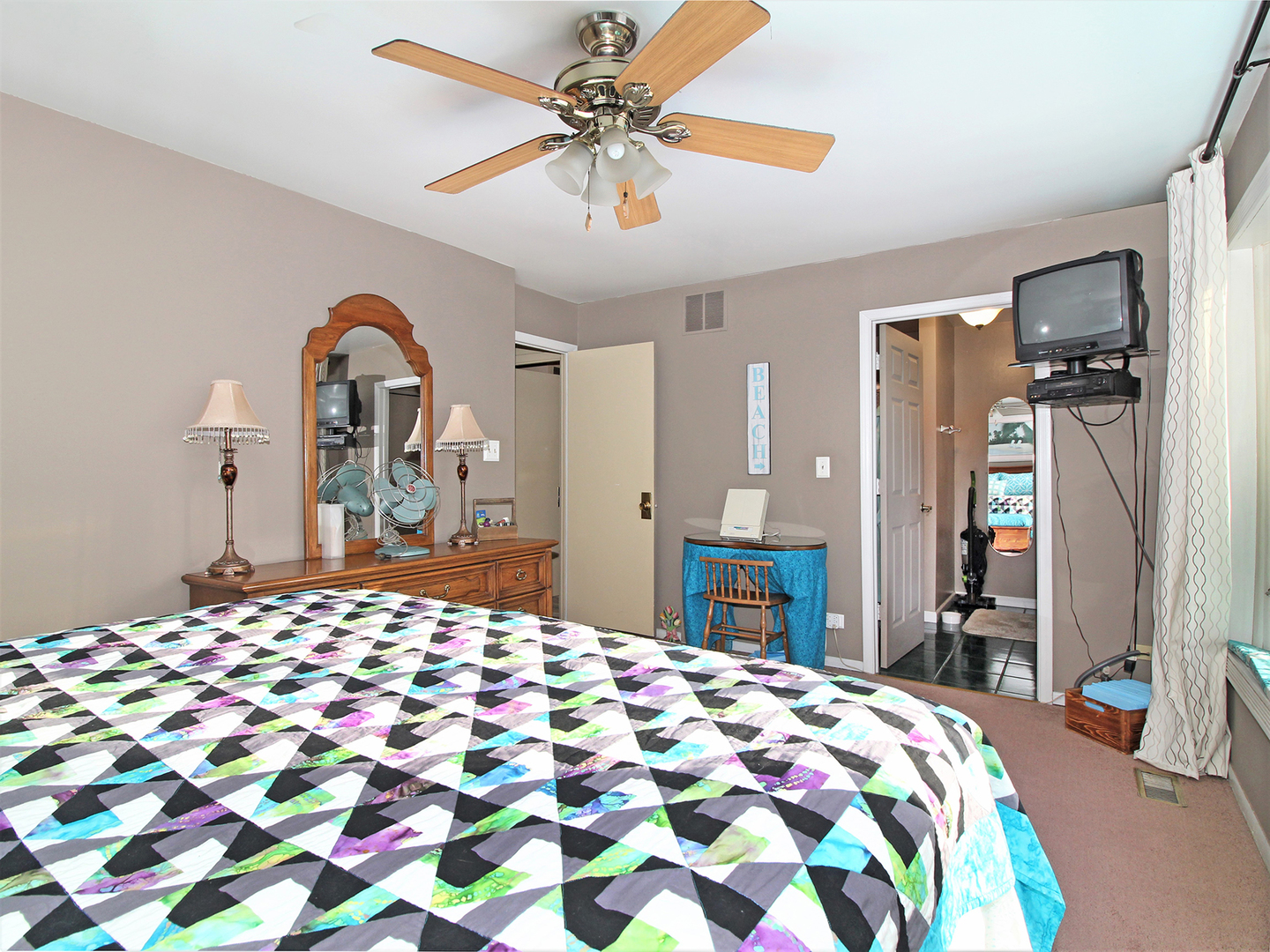 554 Rockhurst Road Bolingbrook, IL 60440 - Photo 16 of 29 a bedroom with a bed and a dresser