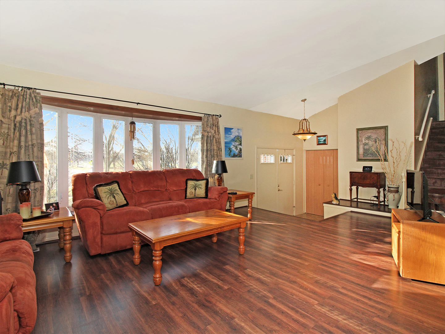 554 Rockhurst Road Bolingbrook, IL 60440 - Photo 5 of 29 a living room with furniture and a flat screen tv