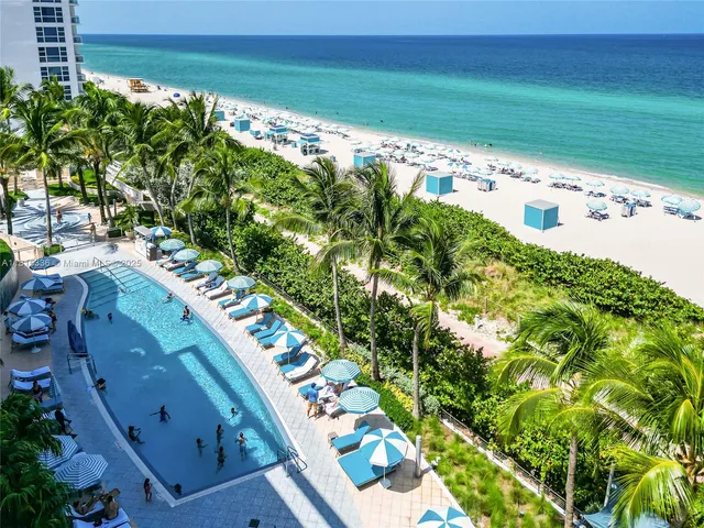 a view of a swimming pool with an outdoor space